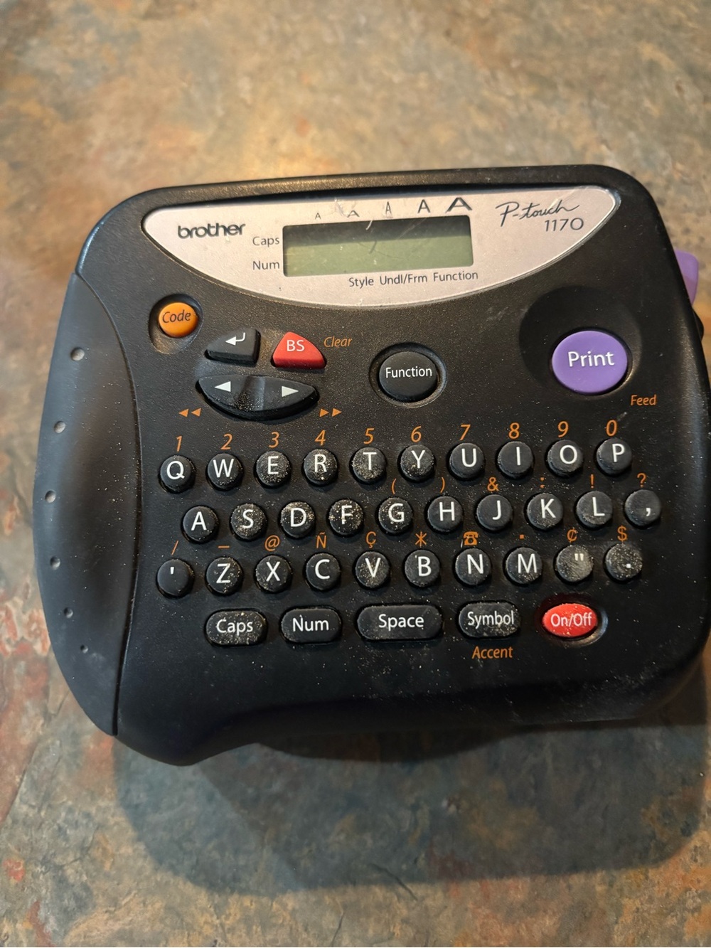 Brother P-touch 1170 Label Maker in Black with Purple Print Button